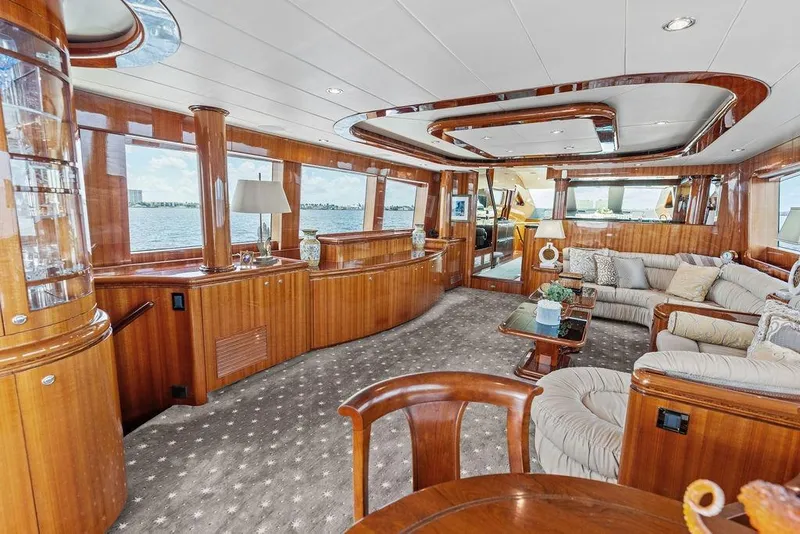 Slide: The Image of Luxurious 2005 Horizon 82 yacht interior with elegant wood finishes and plush seating. - 24