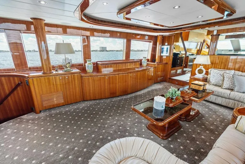 Slide: The Image of Luxurious 2005 Horizon 82 yacht interior with elegant wood finishes and plush seating. - 27