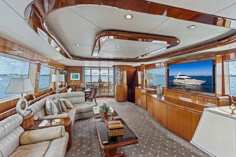 Slide: The Image of Luxurious 2005 Horizon 82 yacht interior with elegant wood finishes and plush seating. - 29