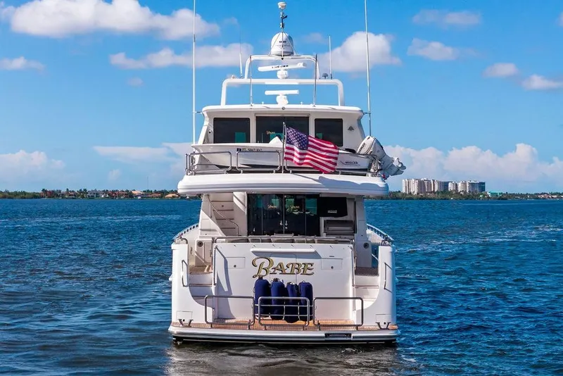 Slide: The Image of Luxury yacht "Babe" on water, Horizon 82 model, 2005, with American flag. - 3