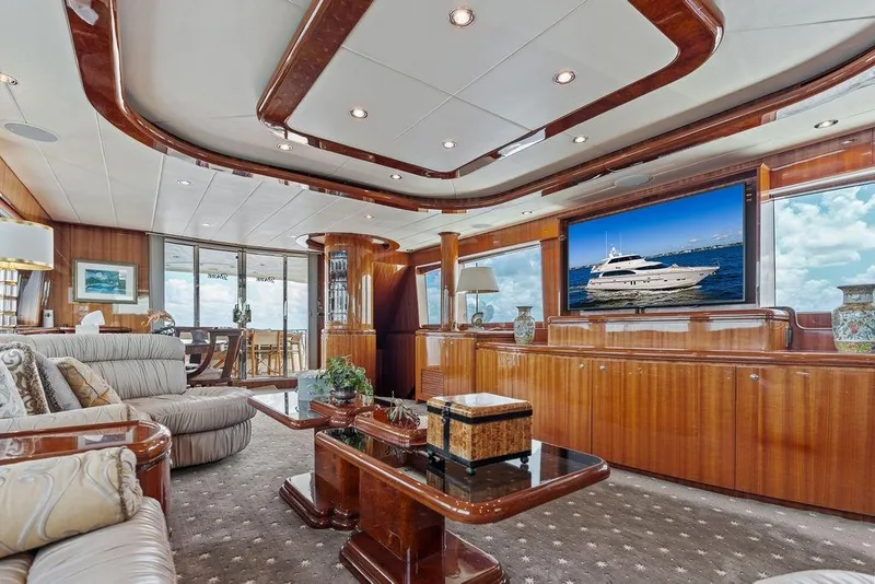 Slide: The Image of Luxurious interior of 2005 Horizon 82 yacht with elegant wood finishes and plush seating. - 30