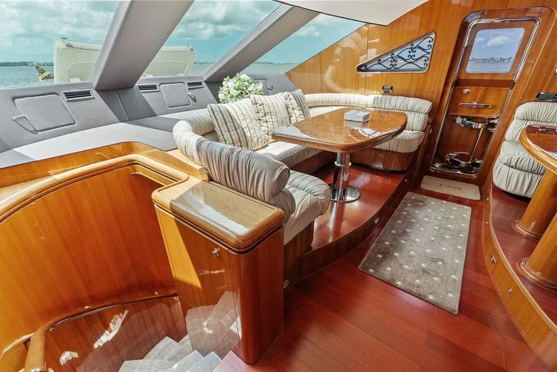 Slide: The Image of Luxurious interior of 2005 Horizon 82 yacht with elegant wood finishes and plush seating. - 38