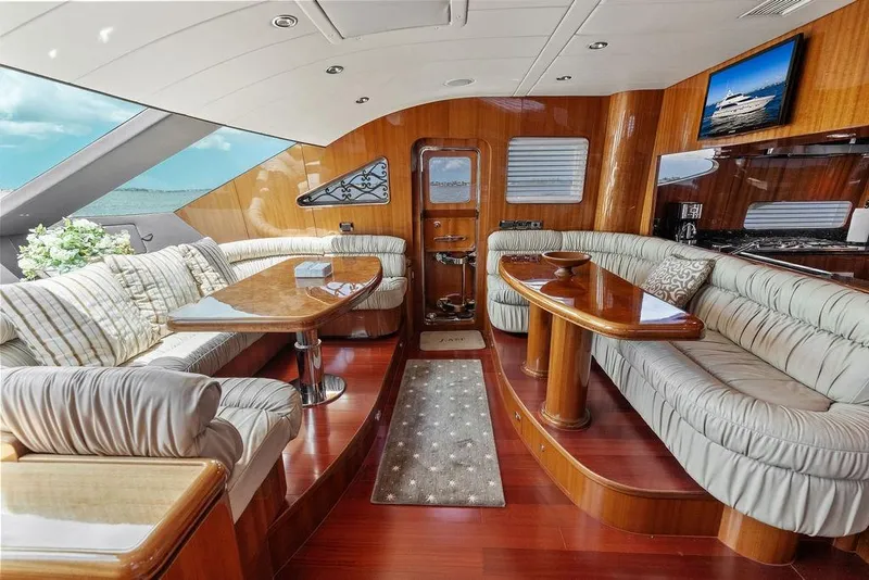 Slide: The Image of Luxurious interior of a 2005 Horizon 82 yacht with elegant wood finishes and plush seating. - 39