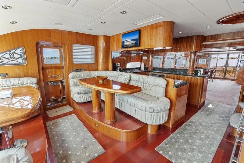 Slide: The Image of Luxurious 2005 Horizon 82 yacht interior with elegant wood finishes and plush seating. - 40