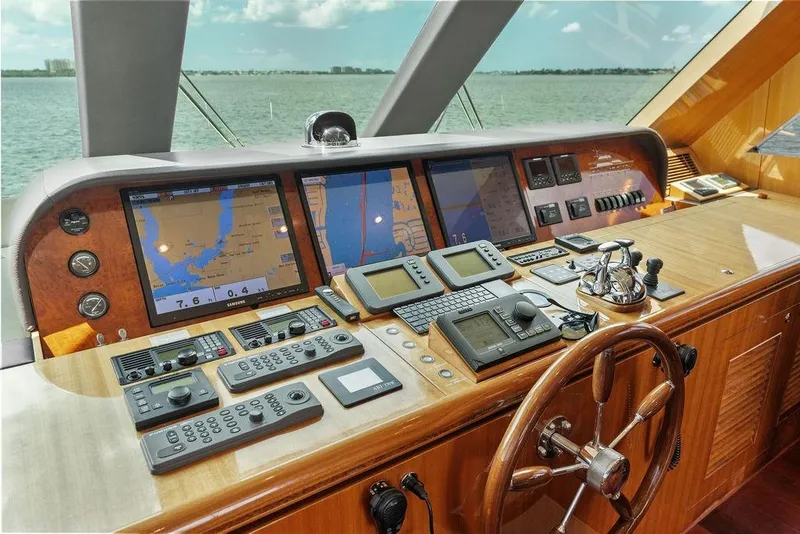 Slide: The Image of Helm of 2005 Horizon 82 yacht with navigation screens and controls. - 43