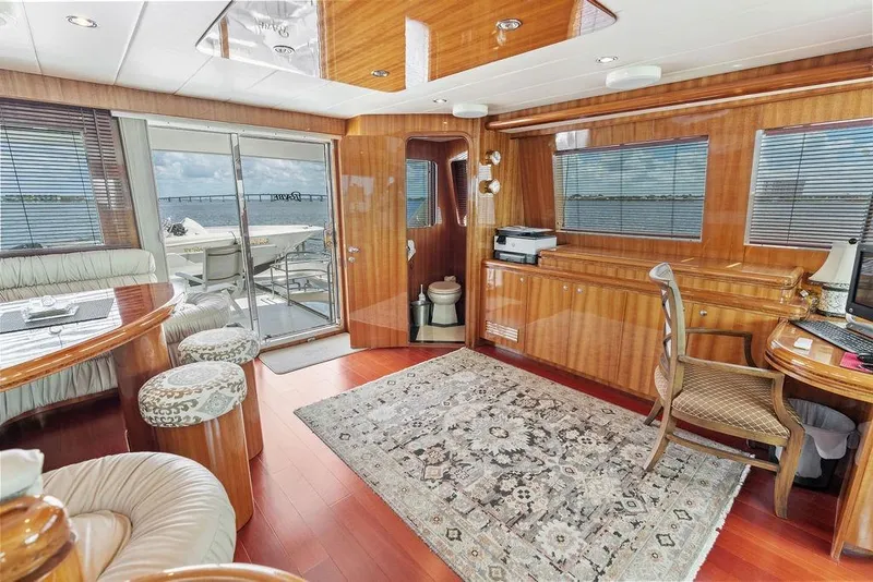 Slide: The Image of Luxurious 2005 Horizon 82 yacht interior with elegant wood finishes and ocean view. - 45