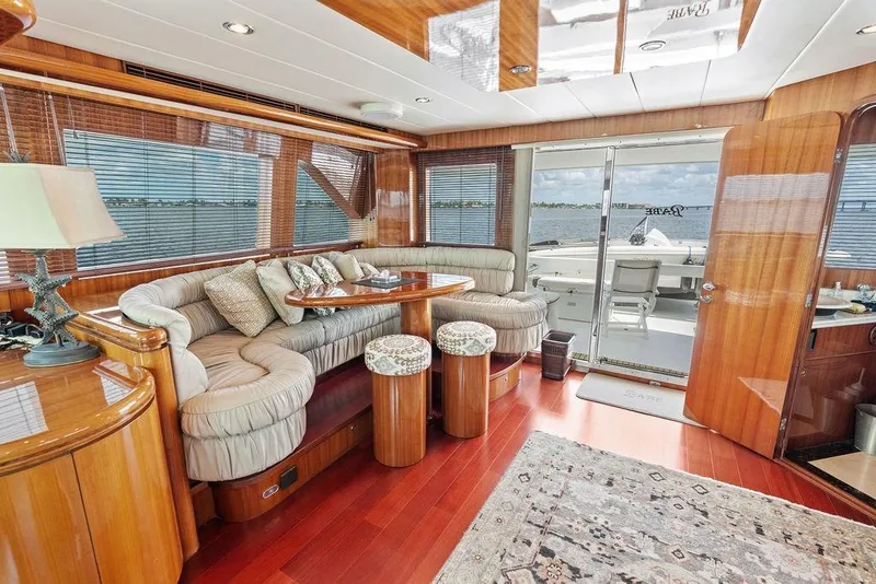 Slide: The Image of Luxurious 2005 Horizon 82 yacht interior with plush seating and elegant wood finishes. - 47