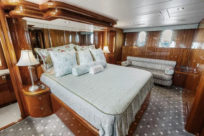 Slide: The Image of Luxurious bedroom interior on 2005 Horizon 82 yacht with elegant bedding and wood finishes. - 53