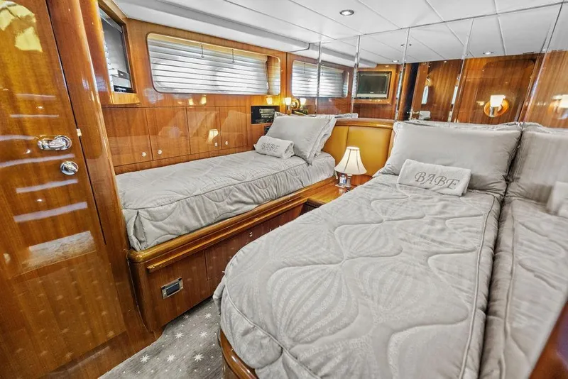 Slide: The Image of Luxurious twin cabin interior on 2005 Horizon 82 yacht with elegant wood paneling. - 65