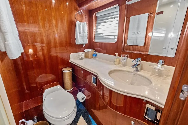 Slide: The Image of Luxurious yacht bathroom with wooden paneling, marble countertop, and modern fixtures, Horizon 82, 2005. - 67