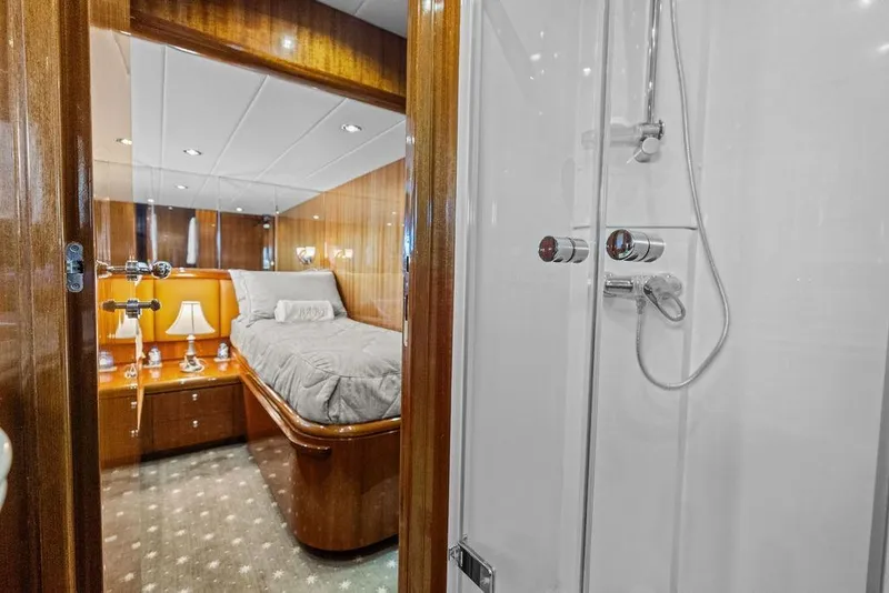 Slide: The Image of Luxurious yacht interior with cozy bedroom and modern shower, Horizon 82, 2005 model. - 68