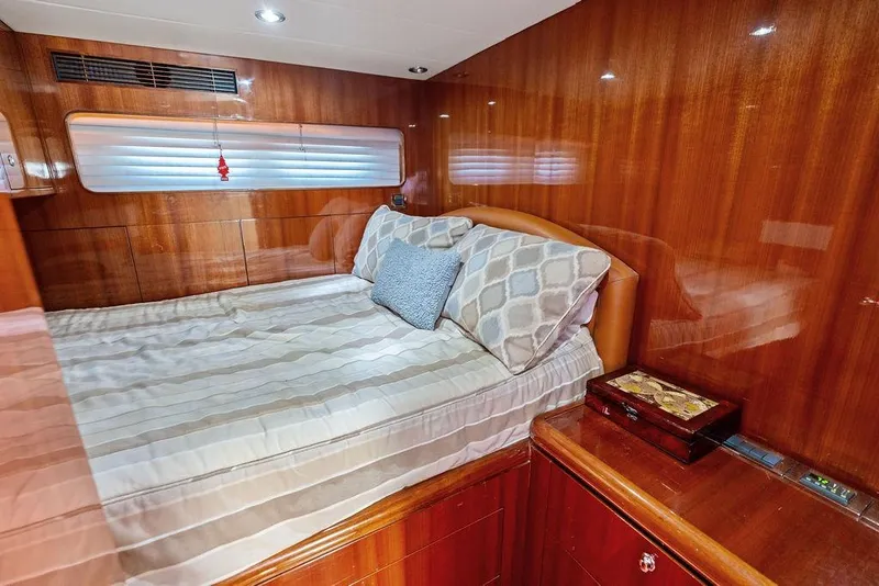 Slide: The Image of Luxurious cabin interior of 2005 Horizon 82 yacht with cozy bed and wooden finish. - 73
