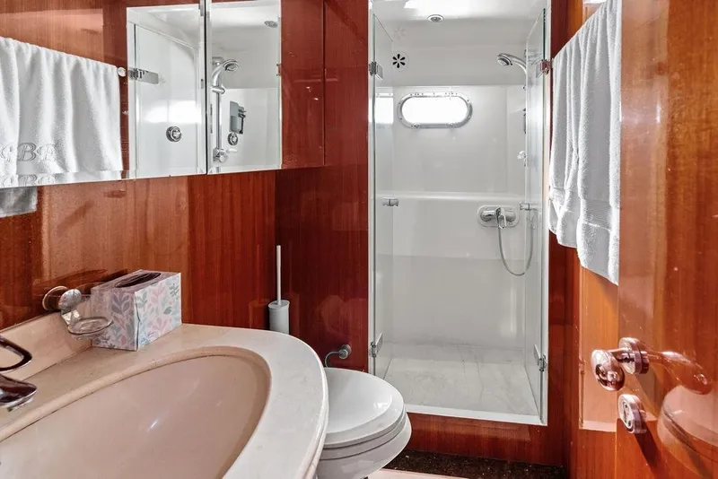 Slide: The Image of Luxurious bathroom on 2005 Horizon 82 yacht with wood paneling and modern shower. - 75