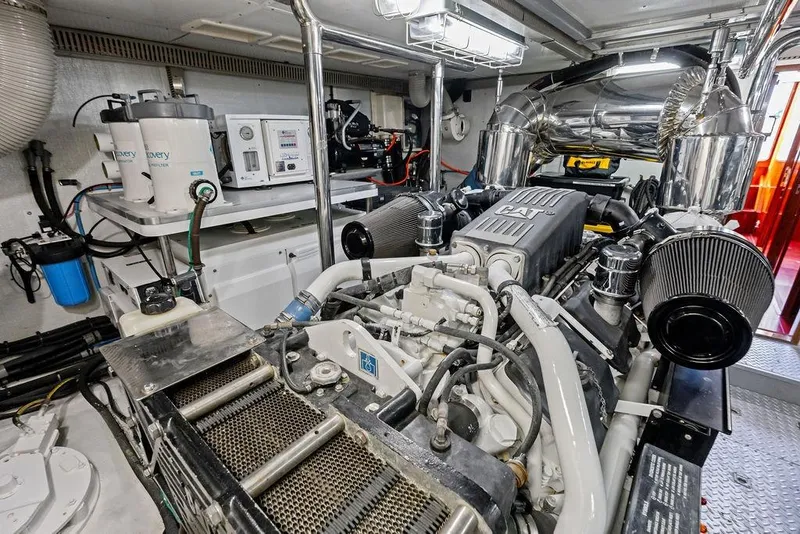 Slide: The Image of Engine room of a 2005 Horizon 82 yacht with CAT machinery and filtration systems. - 81