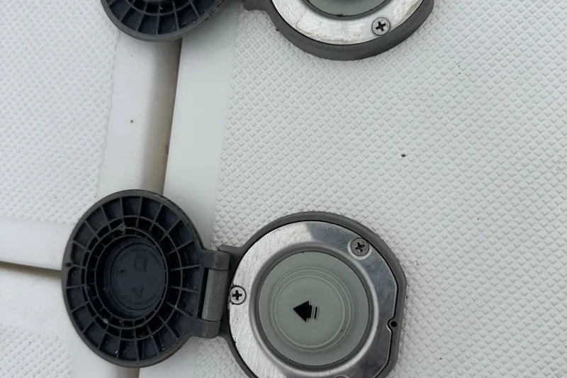 Slide: The Image of Open fuel caps on a 2016 Regal 35 Sport Coupe boat deck. - 46