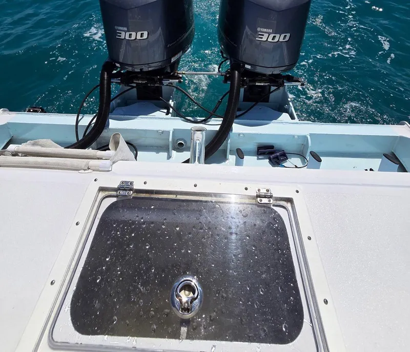 Slide: The Image of 2012 Contender Custom 33 Center Console with twin Yamaha 300 engines on the ocean. - 26