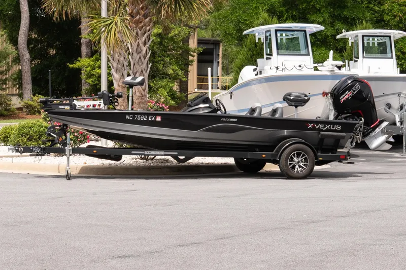 The Image of 2023 Vexus AVX1880 boat on trailer, parked outdoors near palm trees. - 1