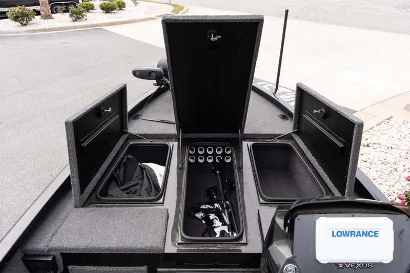 Slide: The Image of 2023 Vexus AVX1880 boat storage compartments with Lowrance electronics. - 12