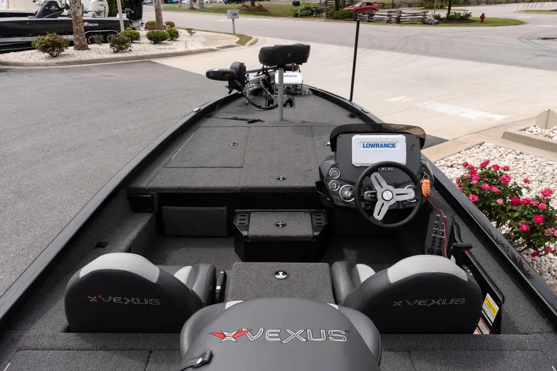 Slide: The Image of 2023 Vexus AVX1880 boat interior with steering console and Lowrance electronics. - 7