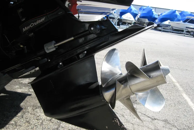 Slide: The Image of Close-up of a 2014 Monterey M3 Sport Boat's MerCruiser propeller in a marina setting. - 10