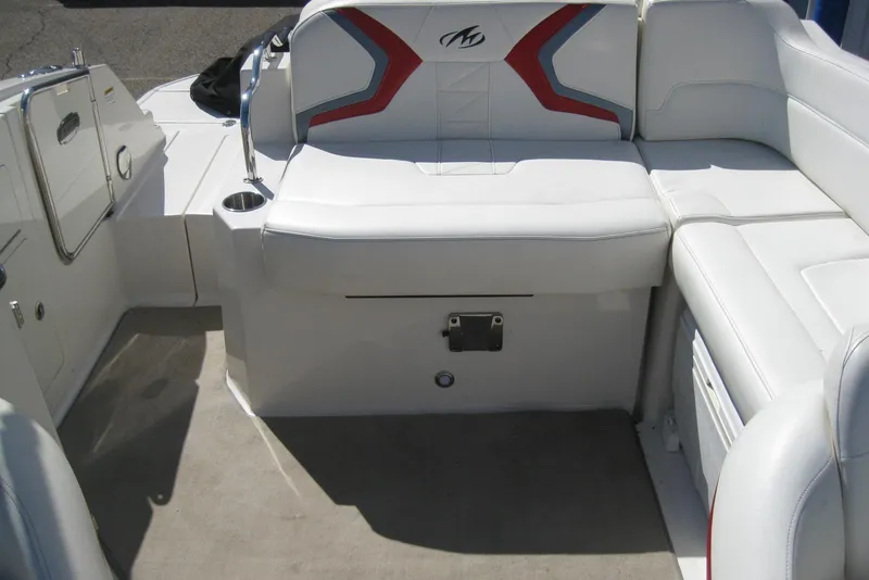 Slide: The Image of 2014 Monterey M3 Sport Boat interior with white seating and red accents. - 16