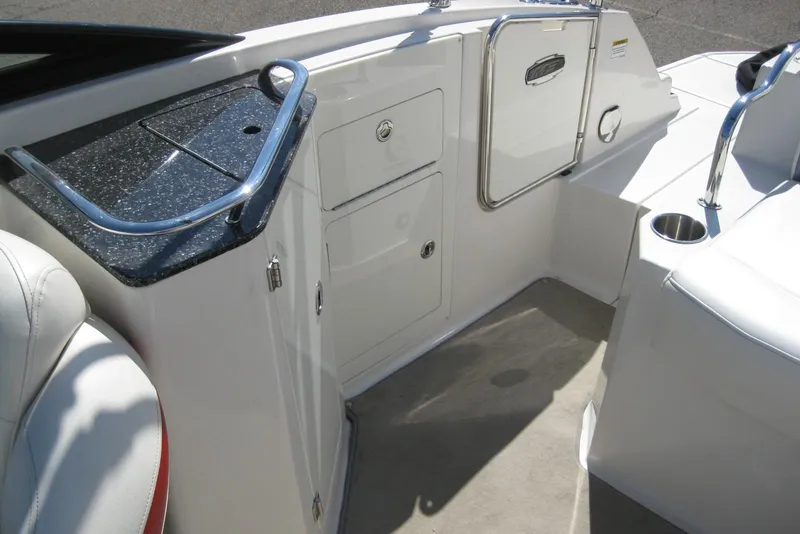 Slide: The Image of 2014 Monterey M3 Sport Boat interior with sleek white seating and storage compartments. - 17