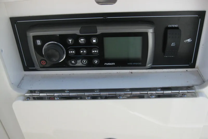Slide: The Image of Control panel of a 2014 Monterey M3 Sport Boat featuring a Fusion MS-IP600 stereo system. - 19
