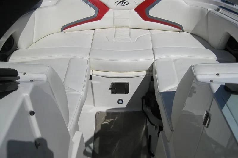 Slide: The Image of 2014 Monterey M3 Sport Boat interior with white leather seating and red accents. - 27