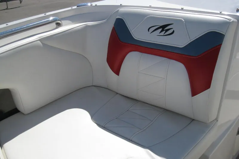 Slide: The Image of 2014 Monterey M3 Sport Boat interior with white, red, and blue seating. - 28