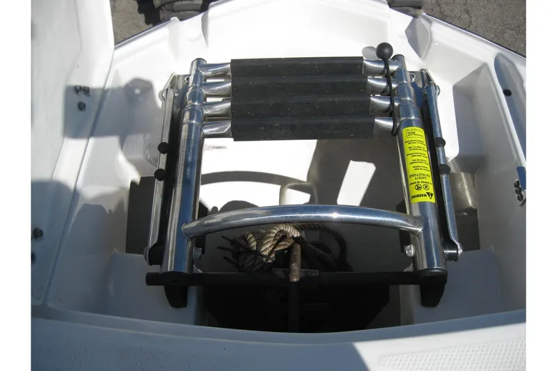 Slide: The Image of 2014 Monterey M3 Sport Boat ladder and anchor storage compartment. - 29