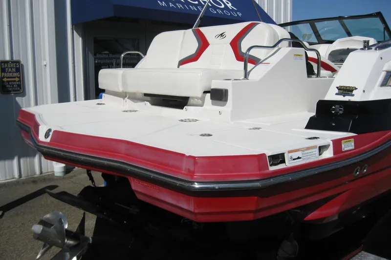 Slide: The Image of 2014 Monterey M3 Sport Boat with red and white design, docked at a marina. - 6