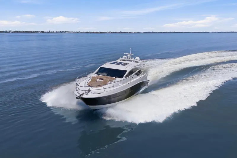 Slide: The Image of 2017 Sea Ray L590 yacht cruising on calm blue waters. - 10