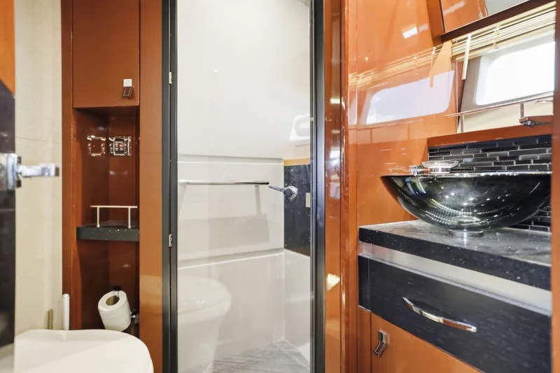 Slide: The Image of Luxurious bathroom interior of 2017 Sea Ray L590 yacht with modern fixtures and elegant design. - 100