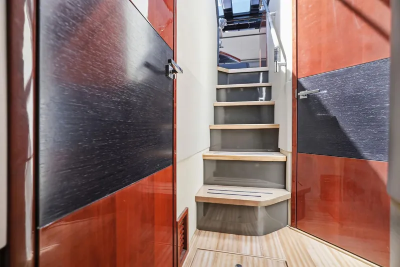 Slide: The Image of Interior stairs of 2017 Sea Ray L590 yacht with modern wood finish. - 106