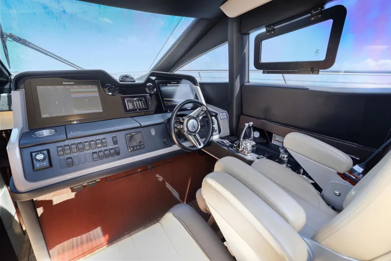 Slide: The Image of 2017 Sea Ray L590 helm with modern navigation displays and luxurious seating. - 109