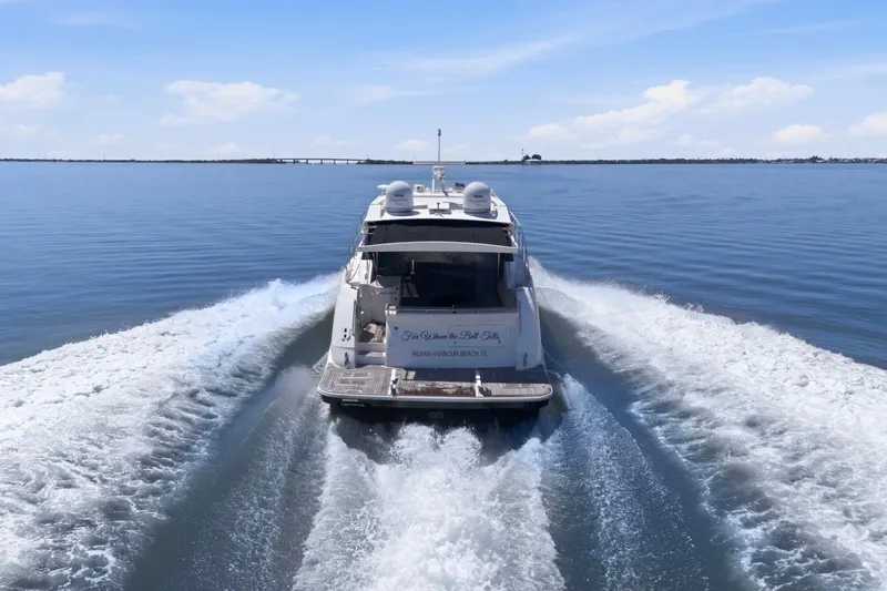 Slide: The Image of 2017 Sea Ray L590 yacht cruising on calm waters under a clear blue sky. - 13