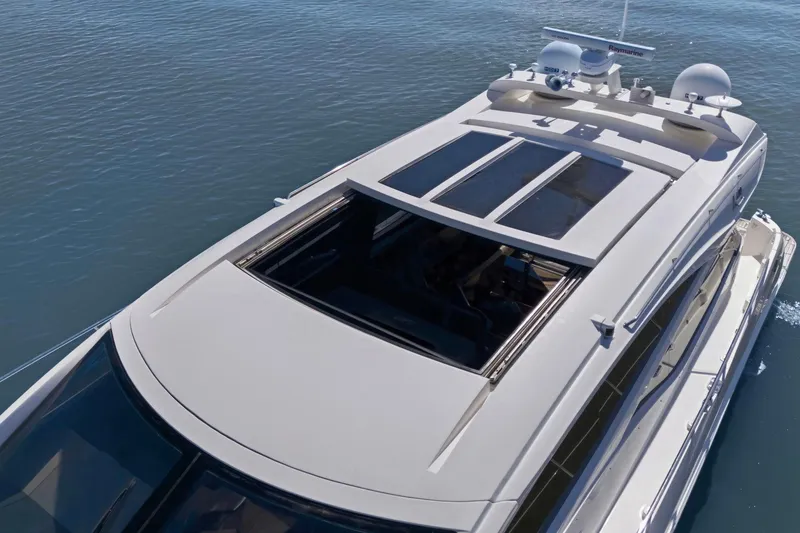 Slide: The Image of 2017 Sea Ray L590 yacht with sunroof, cruising on calm waters. - 15