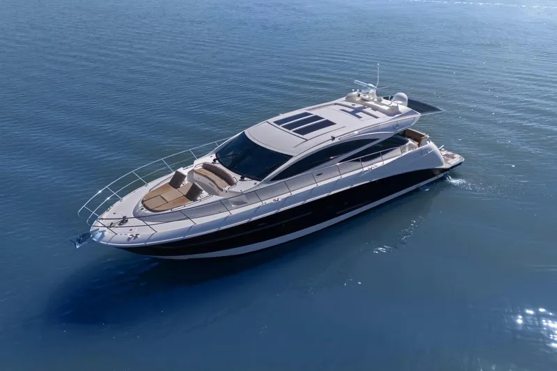 Slide: The Image of 2017 Sea Ray L590 luxury yacht cruising on calm blue waters. - 16