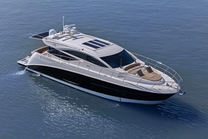Slide: The Image of 2017 Sea Ray L590 luxury yacht cruising on calm blue waters. - 19