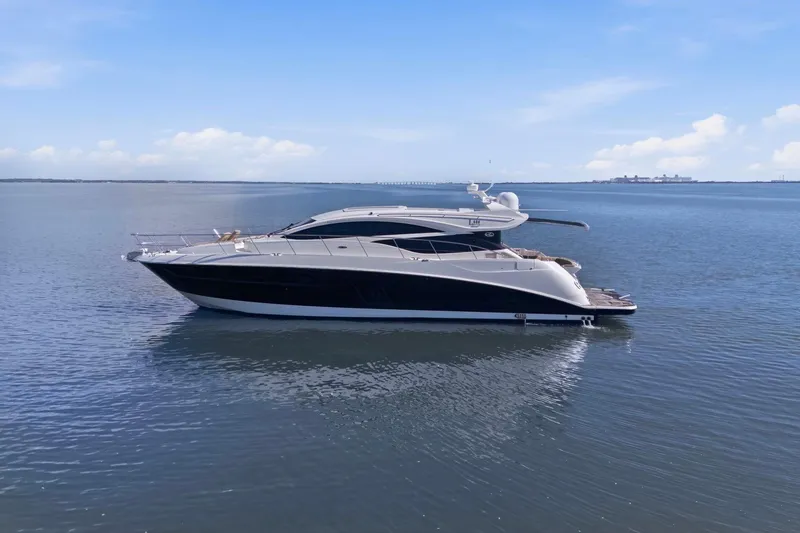 Slide: The Image of 2017 Sea Ray L590 yacht on calm water under a clear blue sky. - 20