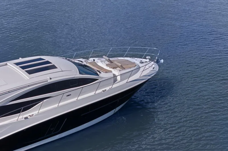 Slide: The Image of 2017 Sea Ray L590 yacht cruising on calm blue waters. - 23