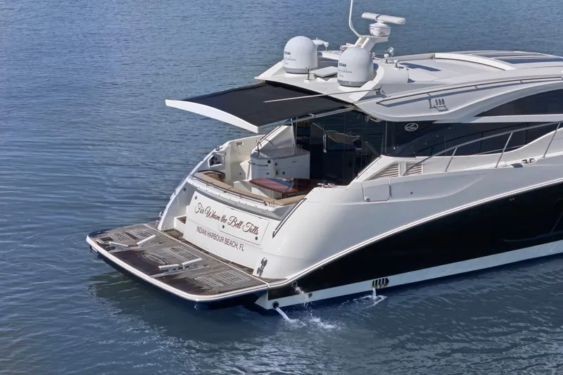 Slide: The Image of 2017 Sea Ray L590 yacht on calm water, featuring sleek design and spacious deck. - 24