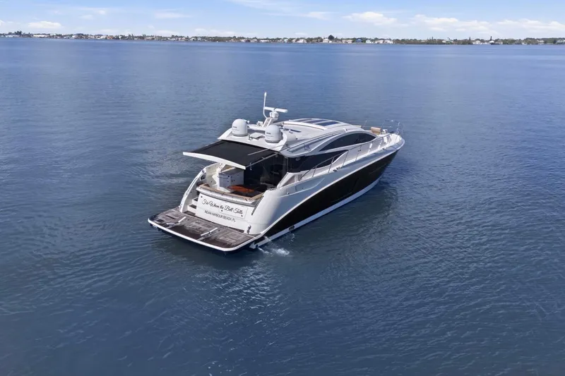 Slide: The Image of 2017 Sea Ray L590 yacht cruising on calm blue waters. - 25