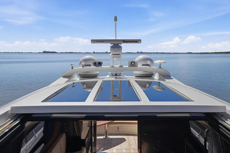 Slide: The Image of 2017 Sea Ray L590 yacht with advanced Raymarine navigation on calm waters. - 28