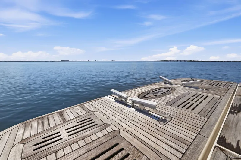 Slide: The Image of 2017 Sea Ray L590 yacht deck overlooking calm ocean waters. - 29