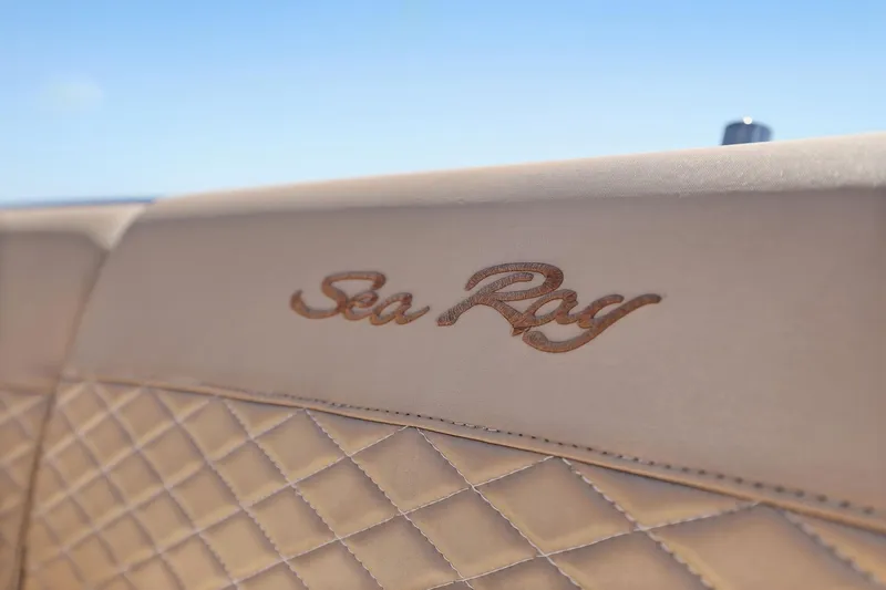 Slide: The Image of Luxurious beige leather seating with Sea Ray logo on 2017 Sea Ray L590 yacht. - 31