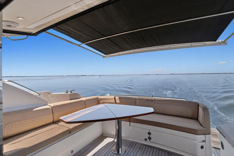Slide: The Image of Luxurious 2017 Sea Ray L590 yacht with elegant seating and ocean view. - 33