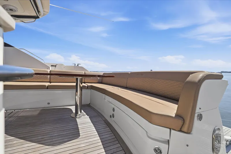 Slide: The Image of Luxurious seating area on a 2017 Sea Ray L590 yacht with ocean view. - 34