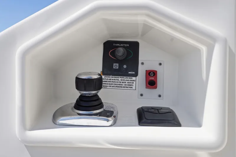 Slide: The Image of Control panel of a 2017 Sea Ray L590 yacht, featuring joystick and thruster controls. - 39