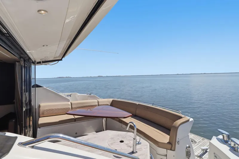 Slide: The Image of Luxurious 2017 Sea Ray L590 yacht with elegant seating and ocean view. - 42